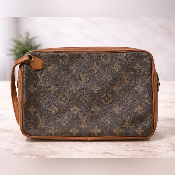 Louis Vuitton Accessories - Vintage Louis Vuitton 1980's Monogram clutch-style. Horizontal exterior zipper.